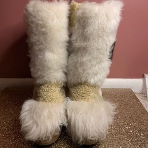 Coach shearling wedge boot.